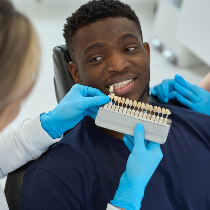 Nurse chooses veneers for male in the clinic